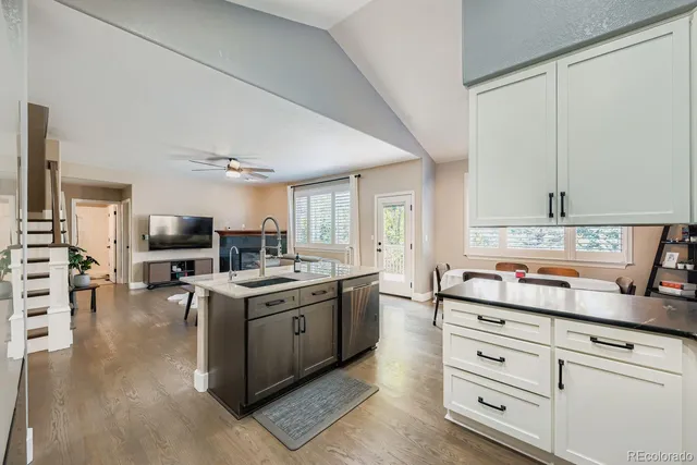 a kitchen with stainless steel appliances granite countertop a stove and cabinets