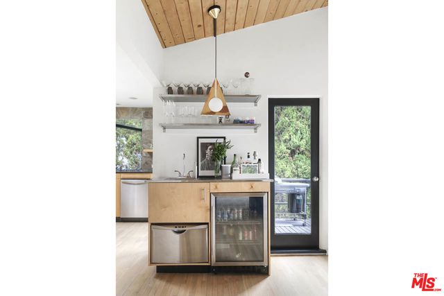 a kitchen with stainless steel appliances granite countertop a stove and a microwave