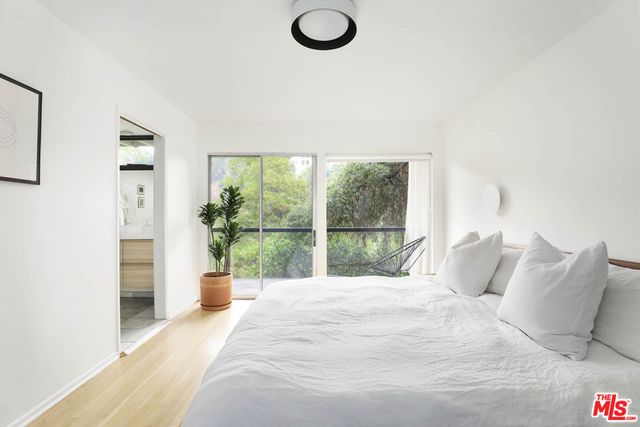 a bedroom with a bed and a table