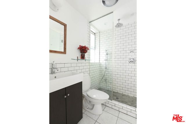 a living room with furniture a window and a chandelier