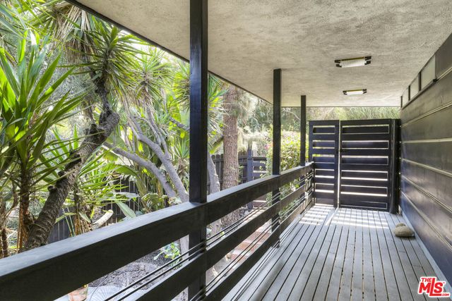 a view of balcony with wooden floor