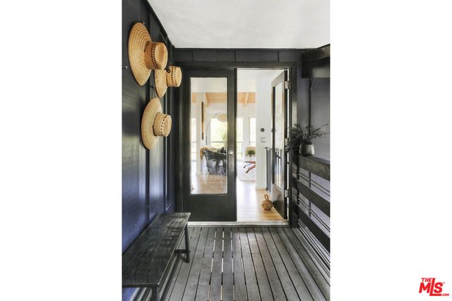 a view of a living room with a wooden floor