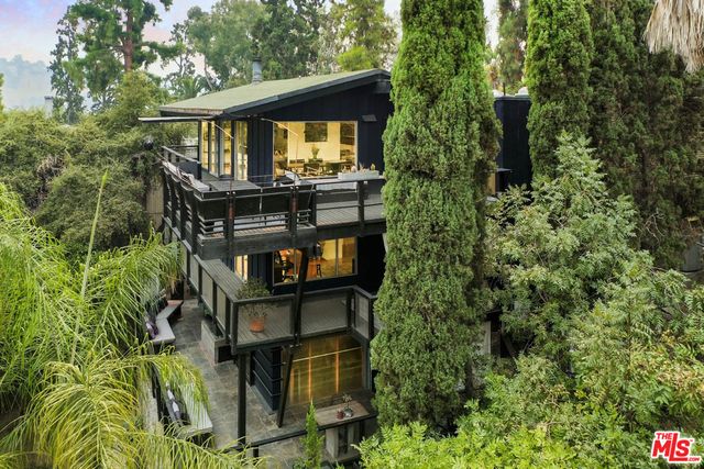 a view of a patio with couches and pool