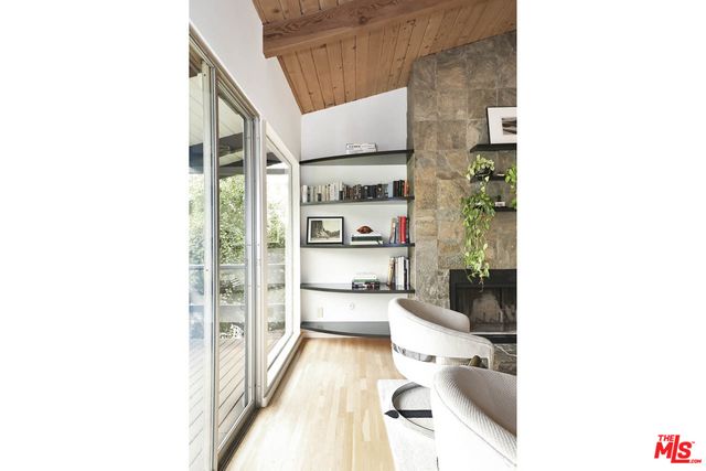 a en suite bathroom with a sink and a large mirror