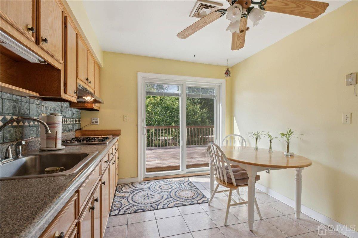 15 Weiss Drive Middlesex, NJ 08846 - Photo 11 of 33 a kitchen with a sink a counter top space and stainless steel appliances