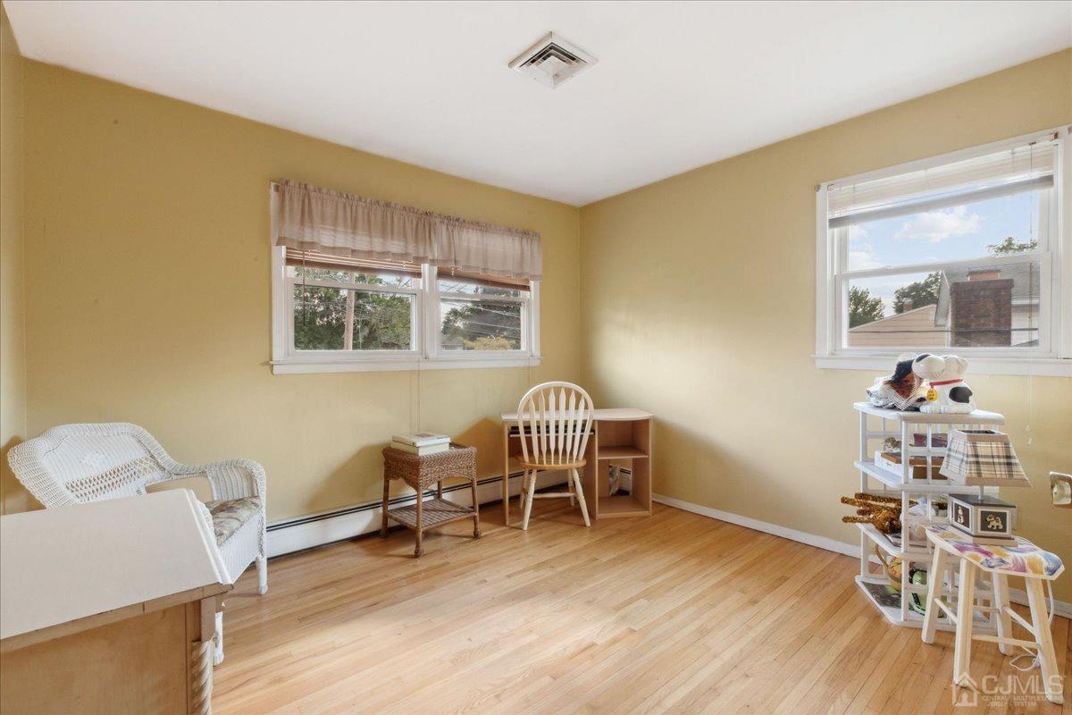 15 Weiss Drive Middlesex, NJ 08846 - Photo 13 of 33 a work room with furniture and a wooden floor