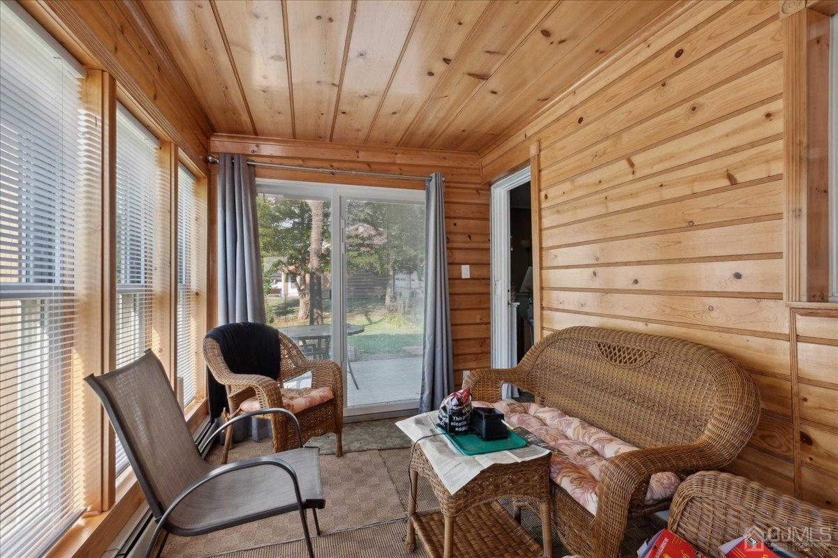 15 Weiss Drive Middlesex, NJ 08846 - Photo 18 of 33 a living room with furniture and a floor to ceiling window