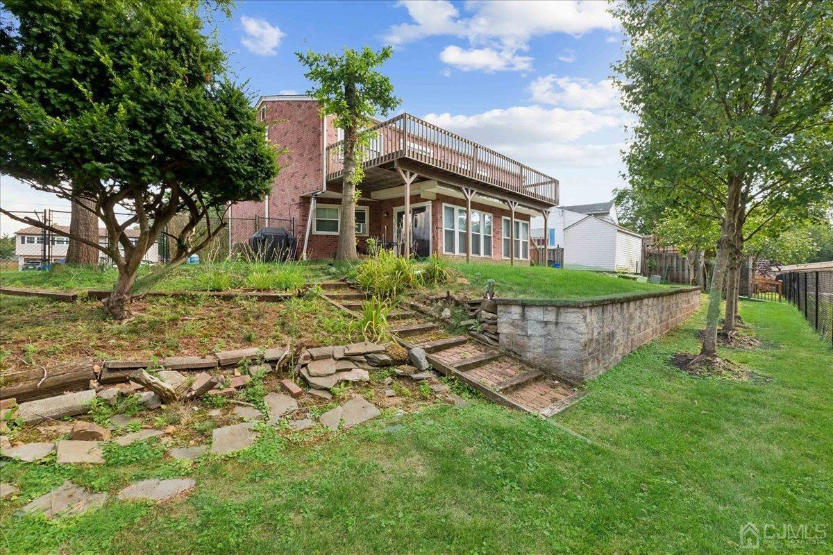 15 Weiss Drive Middlesex, NJ 08846 - Photo 23 of 33 a view of a house with a yard and sitting area