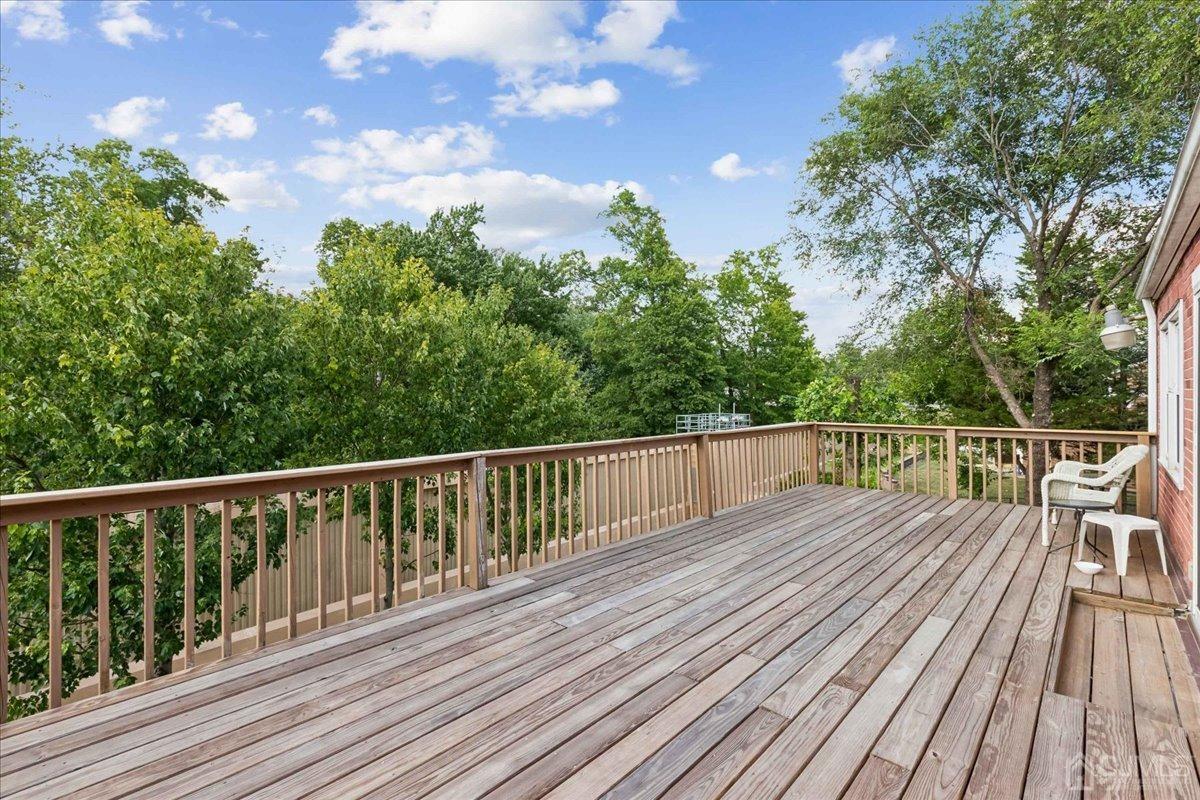 15 Weiss Drive Middlesex, NJ 08846 - Photo 24 of 33 a view of balcony with wooden floor and fence