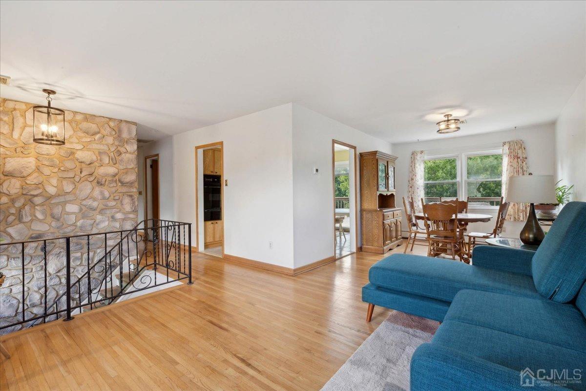 15 Weiss Drive Middlesex, NJ 08846 - Photo 6 of 33 a living room with furniture and wooden floor