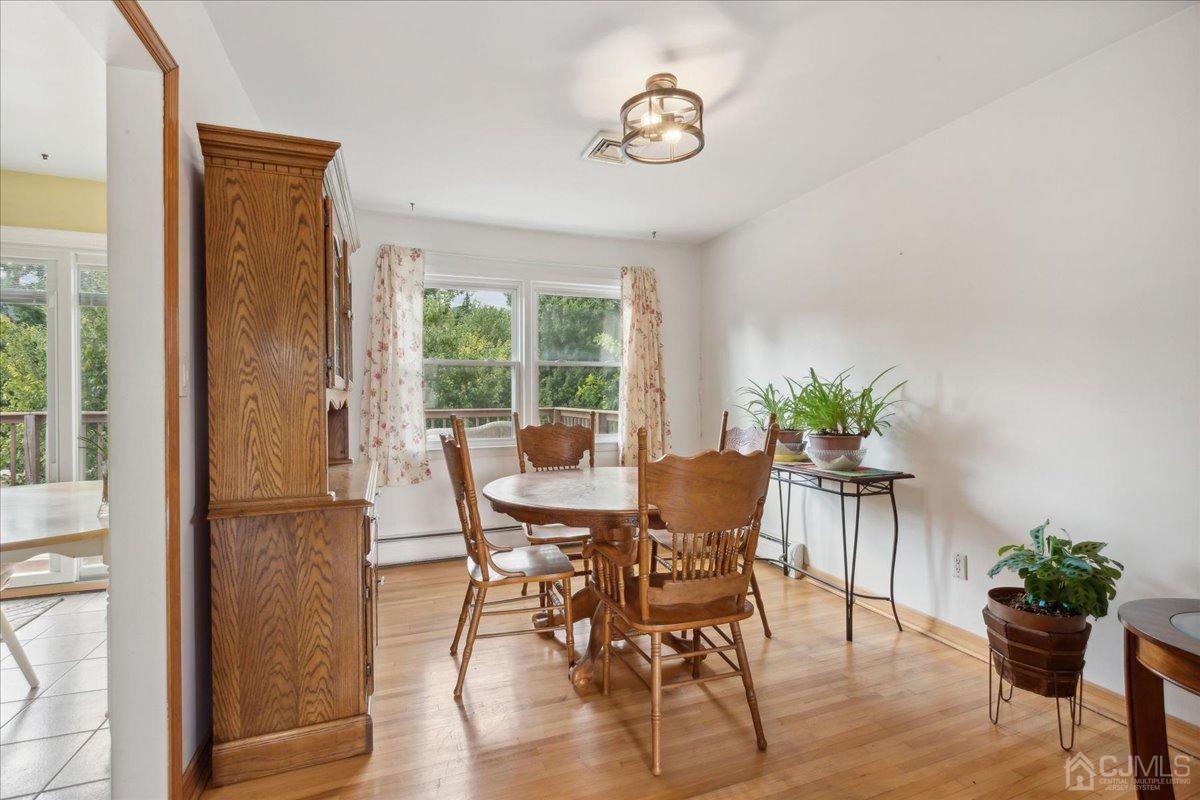 15 Weiss Drive Middlesex, NJ 08846 - Photo 7 of 33 a view of a dining room with furniture window and wooden floor
