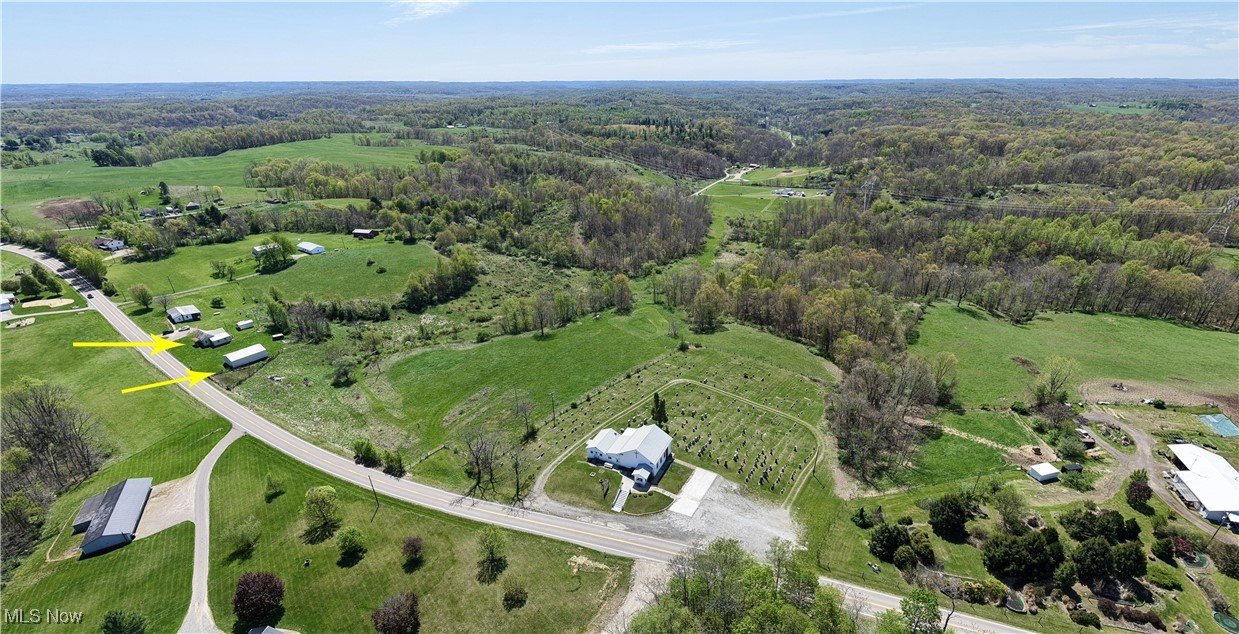 7166 Clay Pike Road Cambridge, OH 43725 - Photo 4 of 27 Aerial view with a forest view