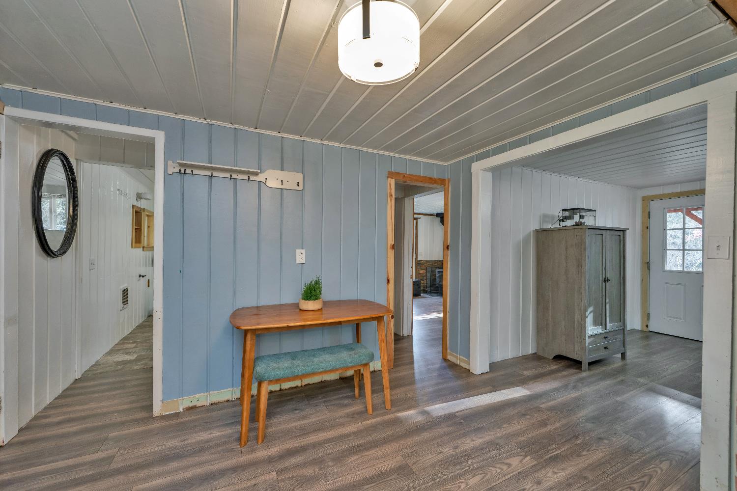 5921 Bear Creek Road Garden Valley, CA 95633 - Photo 11 of 55 a view of a hallway with wooden floor and glass door
