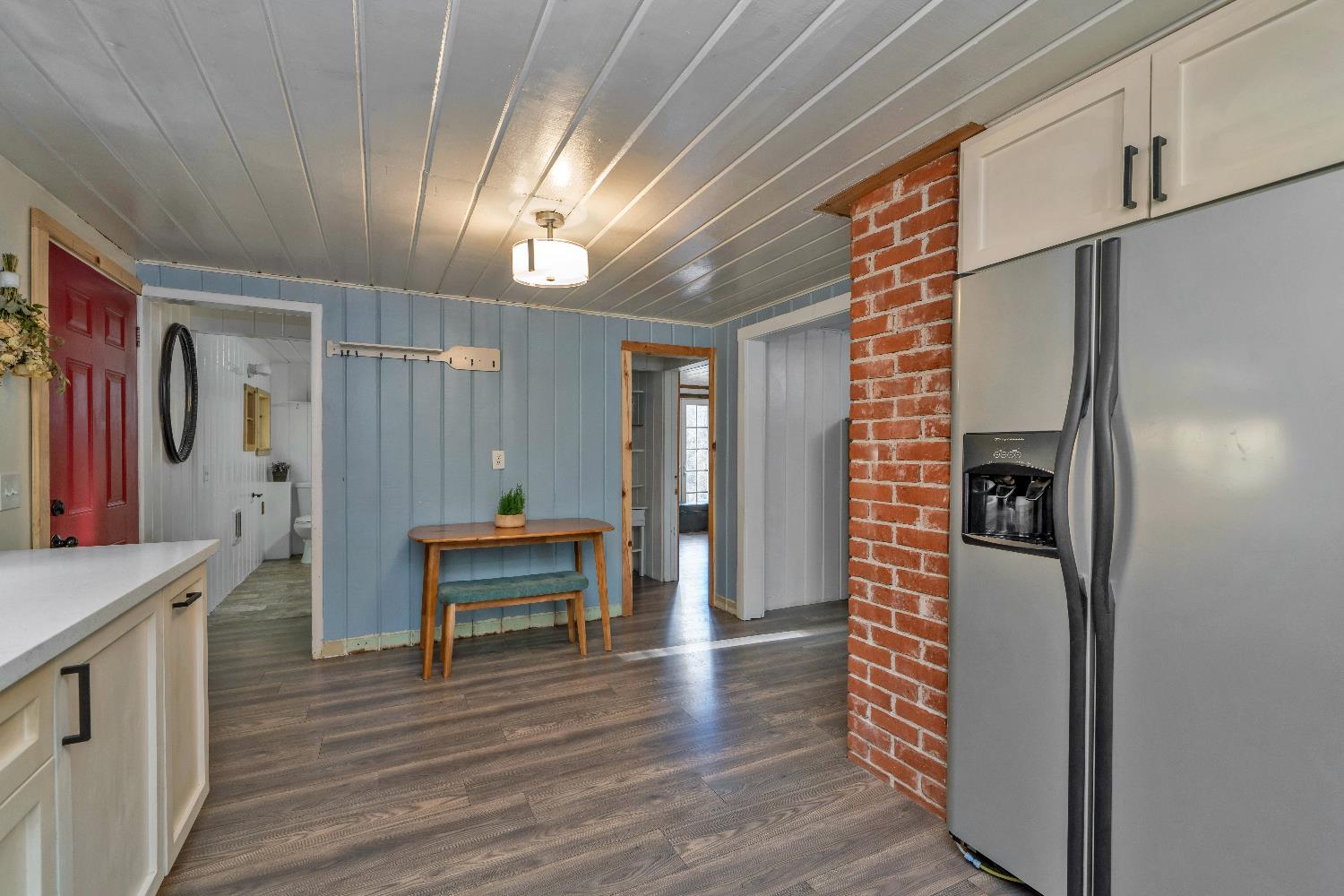 5921 Bear Creek Road Garden Valley, CA 95633 - Photo 16 of 55 a view of a hallway with wooden floor and staircase