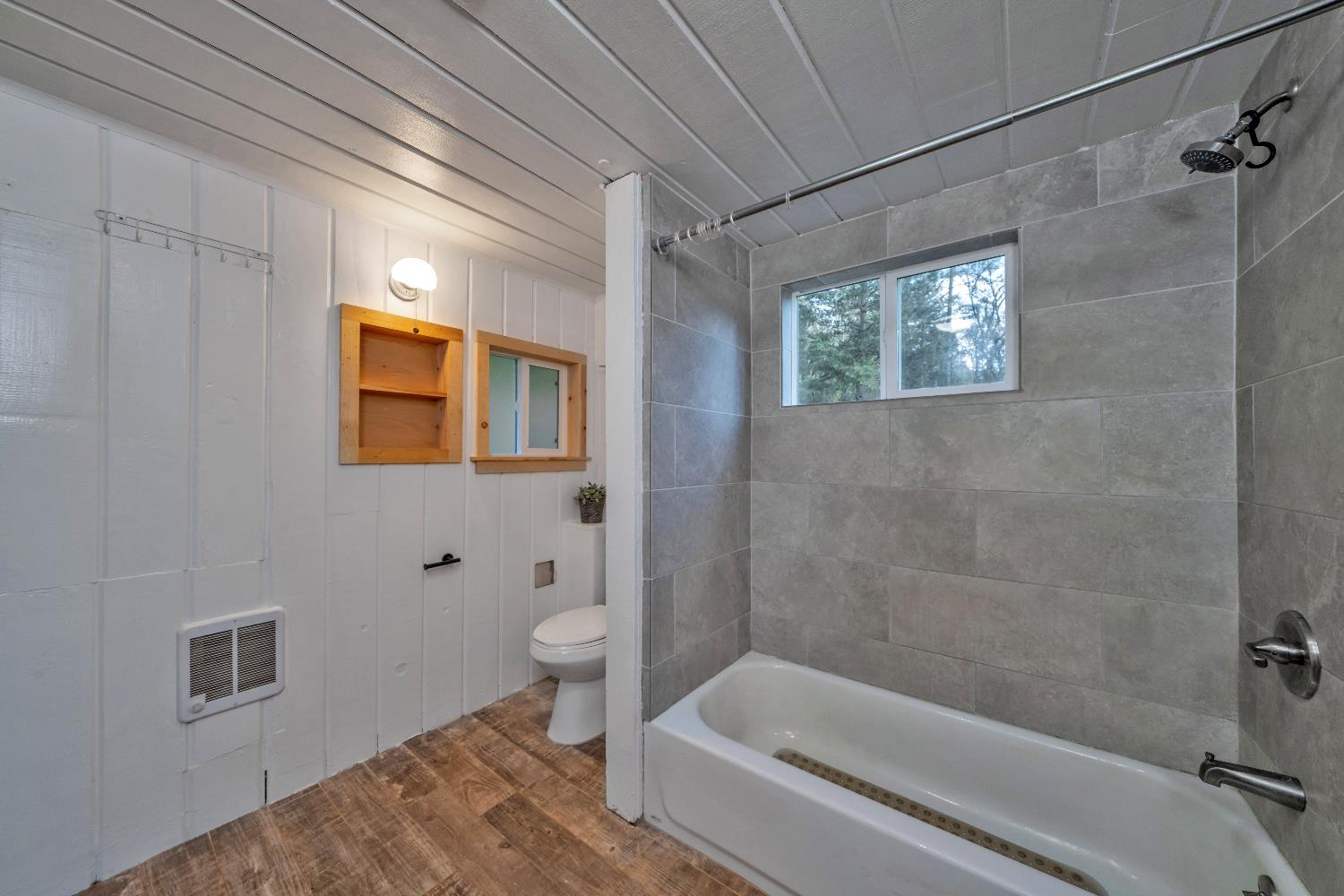 5921 Bear Creek Road Garden Valley, CA 95633 - Photo 19 of 55 a bathroom with a toilet and a bathtub