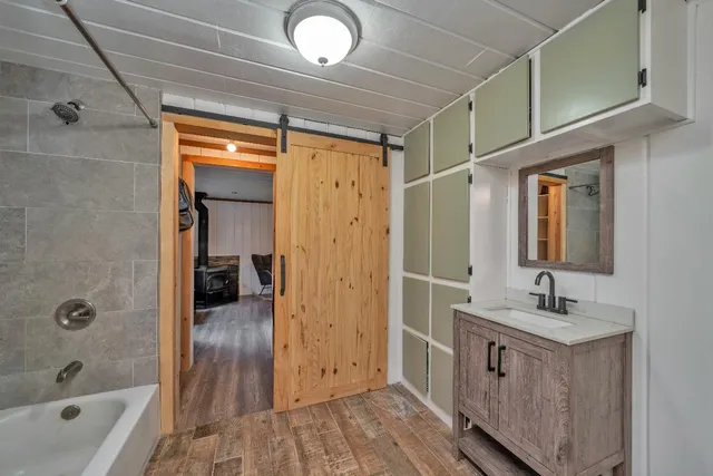 a bathroom with a toilet a sink and bathtub