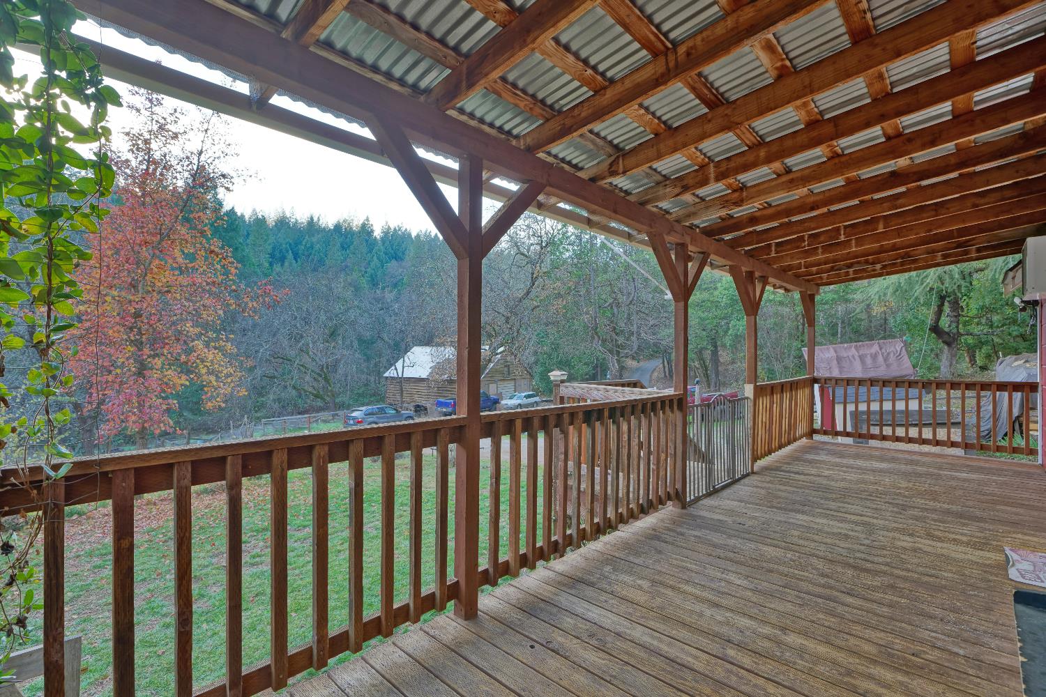 5921 Bear Creek Road Garden Valley, CA 95633 - Photo 2 of 55 a porch with wooden floor in outdoor space