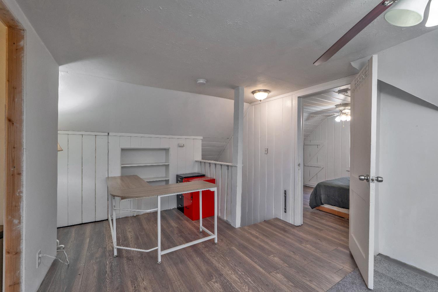 5921 Bear Creek Road Garden Valley, CA 95633 - Photo 25 of 55 a walk in closet with wooden floor and bedroom view