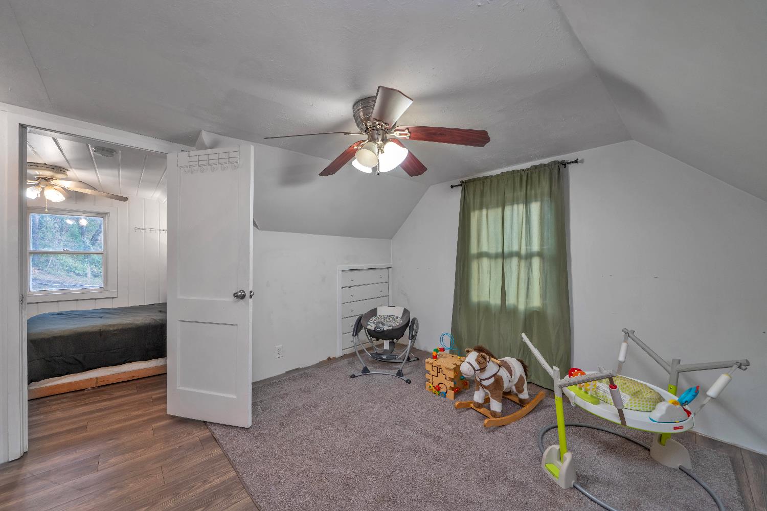 5921 Bear Creek Road Garden Valley, CA 95633 - Photo 29 of 55 a room with chandelier fan and windows