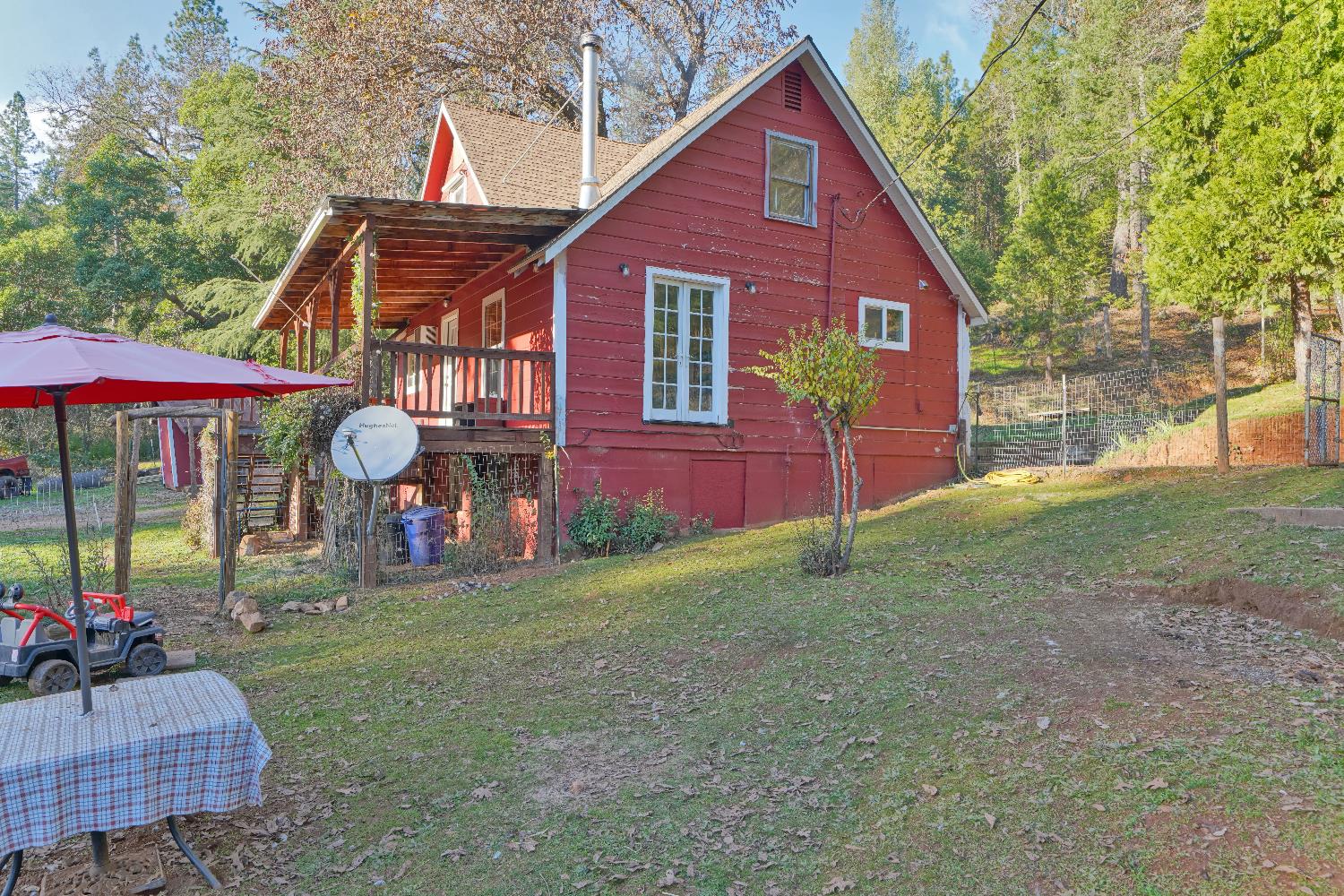 5921 Bear Creek Road Garden Valley, CA 95633 - Photo 39 of 55 a view of a house with a yard and sitting area