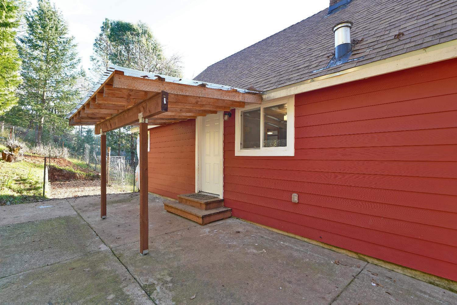 5921 Bear Creek Road Garden Valley, CA 95633 - Photo 43 of 55 a backyard of a house with seating space