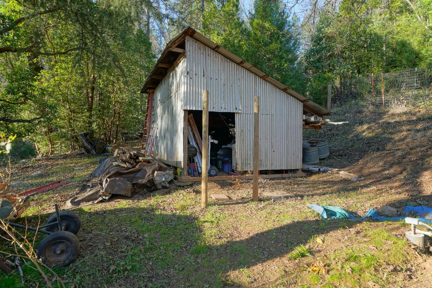 5921 Bear Creek Road Garden Valley, CA 95633 - Photo 55 of 55 a view of backyard with wooden fence and a large tree