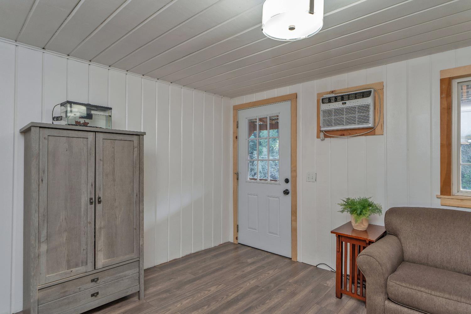5921 Bear Creek Road Garden Valley, CA 95633 - Photo 9 of 55 a living room with furniture and a potted plant