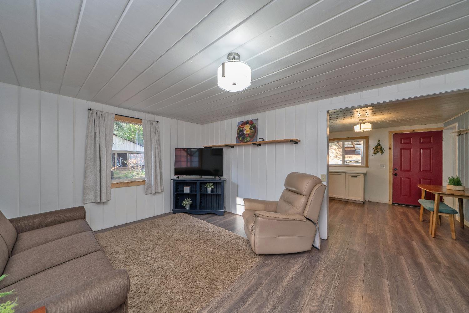 5921 Bear Creek Road Garden Valley, CA 95633 - Photo 10 of 55 a living room with furniture and a flat screen tv