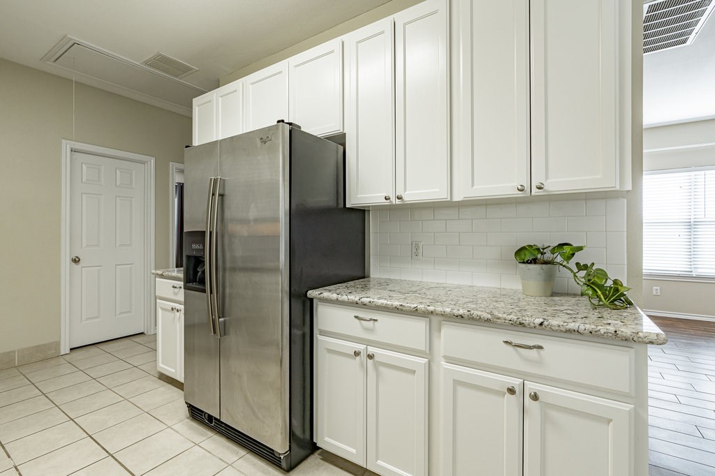 6007 Fairway Street, Unit C Austin, TX 78741 - Photo 10 of 22 a kitchen with stainless steel appliances granite countertop a refrigerator and a sink