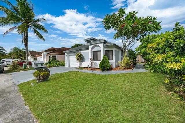 a house with garden in front of it