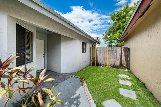 a front view of a house with yard