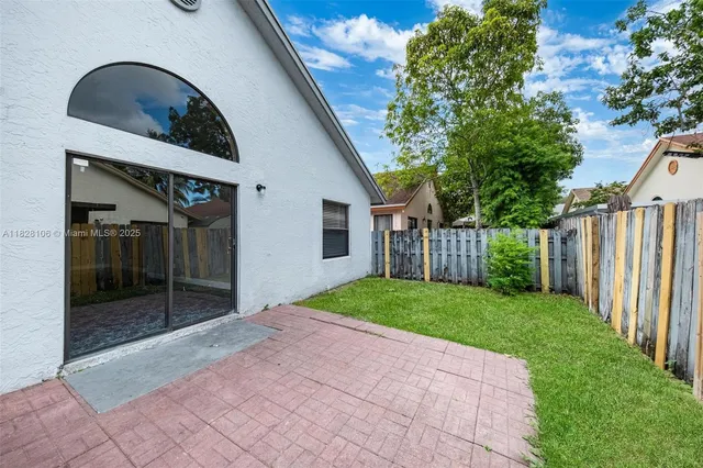 a view of backyard with green space