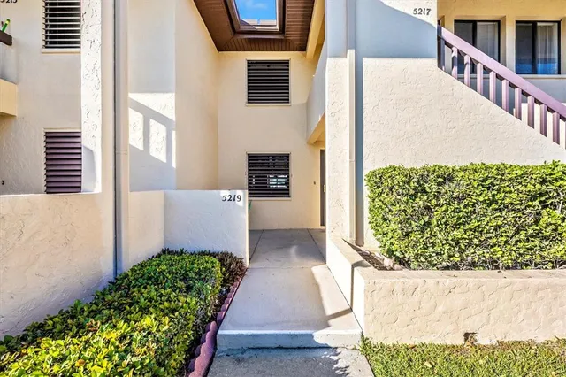 a kitchen with stainless steel appliances cabinets a sink and a stove