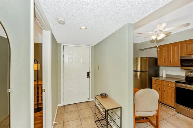 a kitchen with a sink appliances and cabinets
