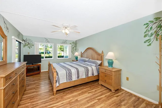 a bathroom with a toilet a sink and a large mirror