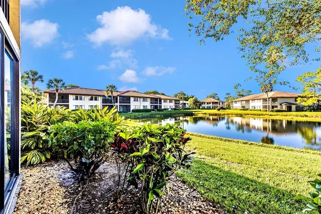 a view of kitchen and dining area with windows