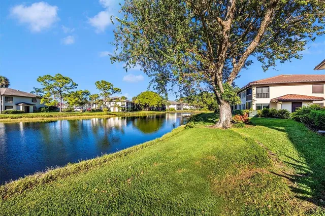 a view of a swimming pool and a lawn chairs