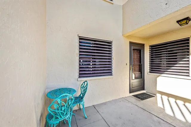 a view of a terrace with sitting area