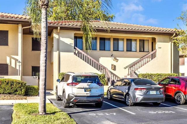 a dining room with furniture and chandelier