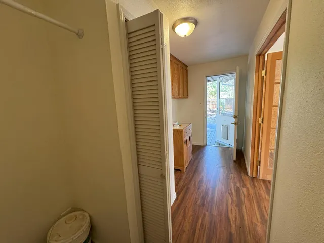 a view of a bathroom with wooden floor