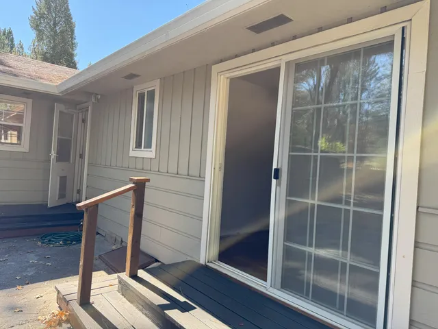 a view of balcony with wooden floor and windows