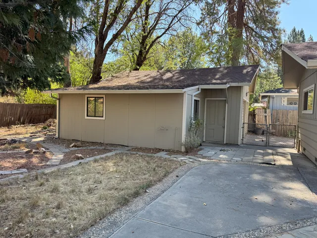 a house with a tree in the background