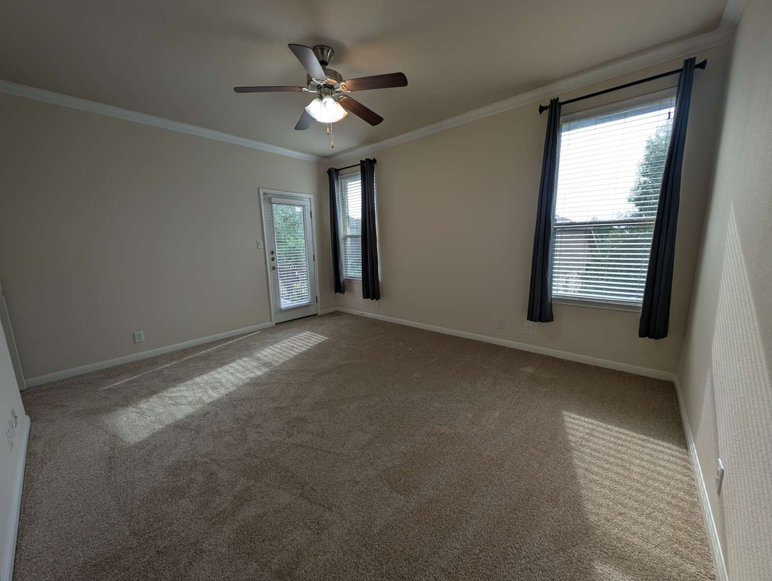 7301 Bandera Ranch Trail, Unit A Austin, TX 78750 - Photo 17 of 20 A quiet bedroom offering carpeted comfort and a private outdoor access point.