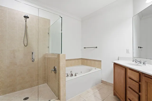 a bathroom with a bathtub and shower