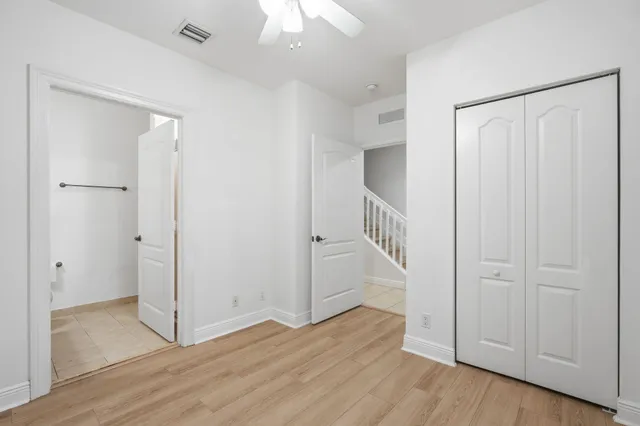 a view of an entryway with wooden floor