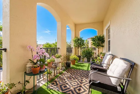 a view of a swimming pool with an outdoor seating
