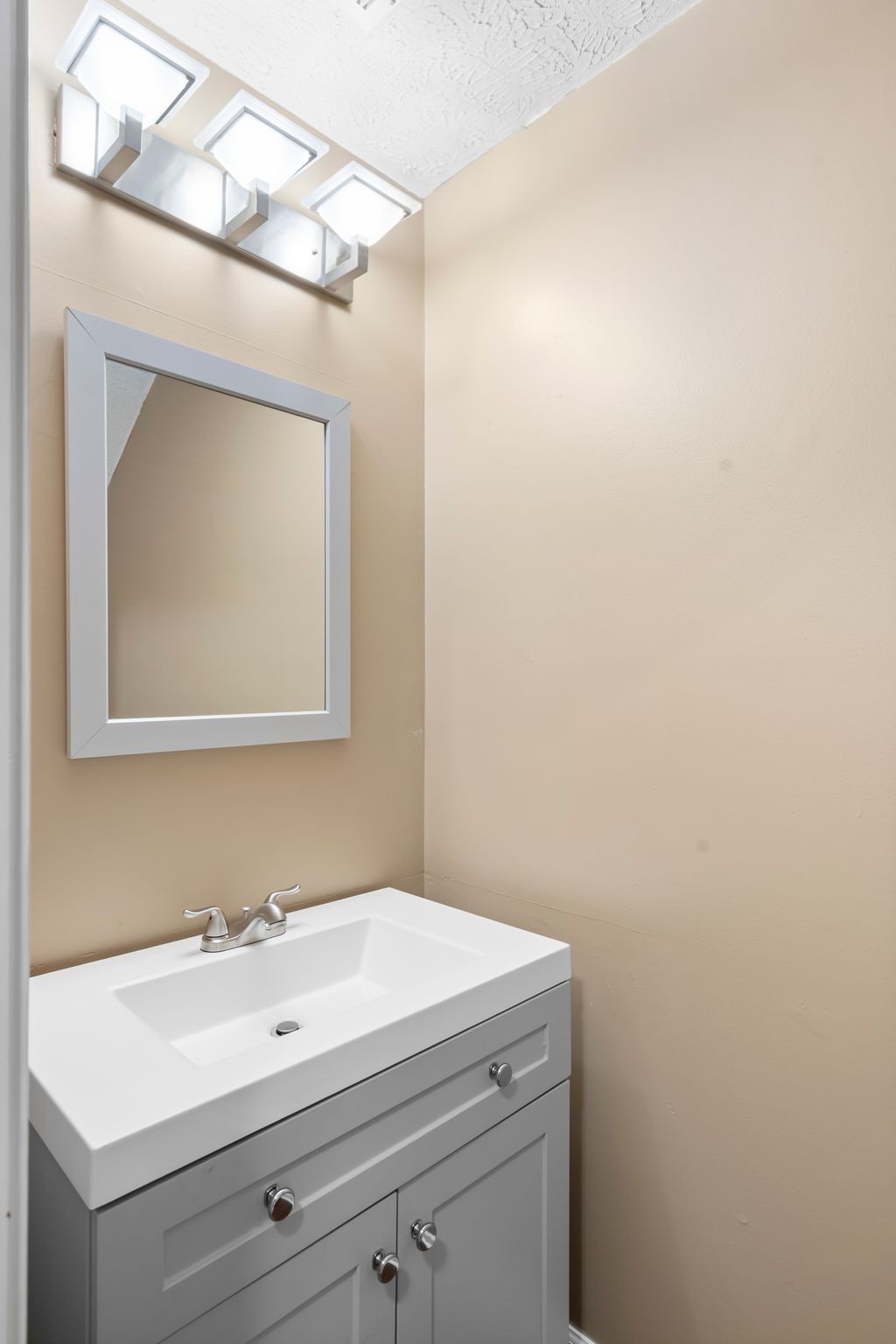 1000 Wells Way Spring Hill, TN 37174 - Photo 15 of 36 a bathroom with a sink and a mirror