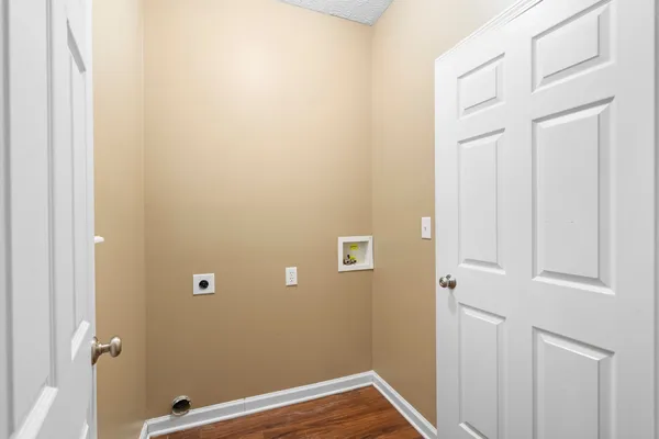 a view of a livingroom with wooden floor