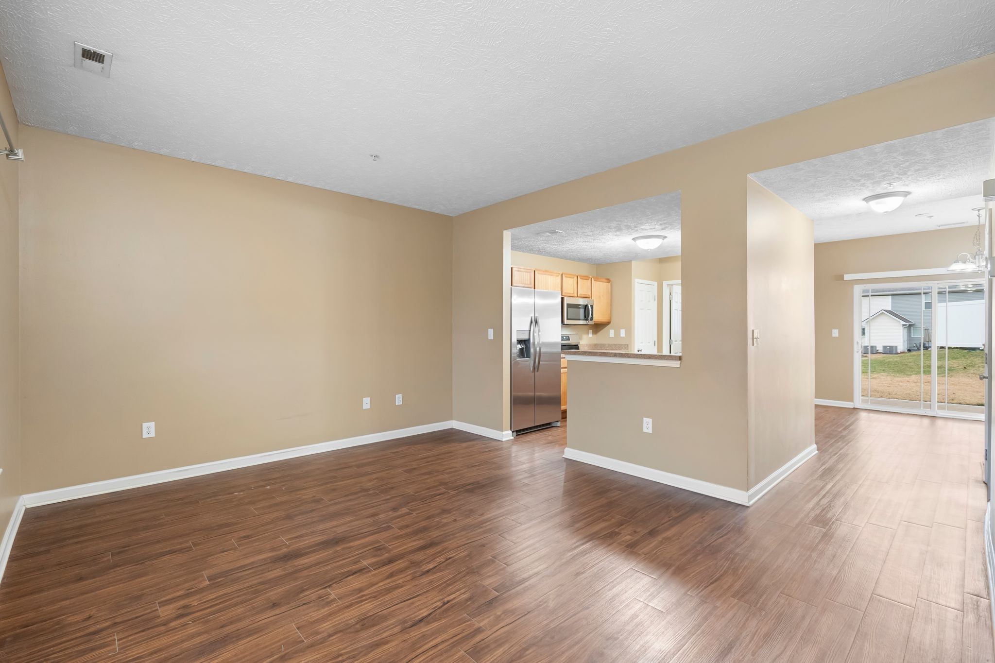 1000 Wells Way Spring Hill, TN 37174 - Photo 4 of 36 an empty room with wooden floor and windows