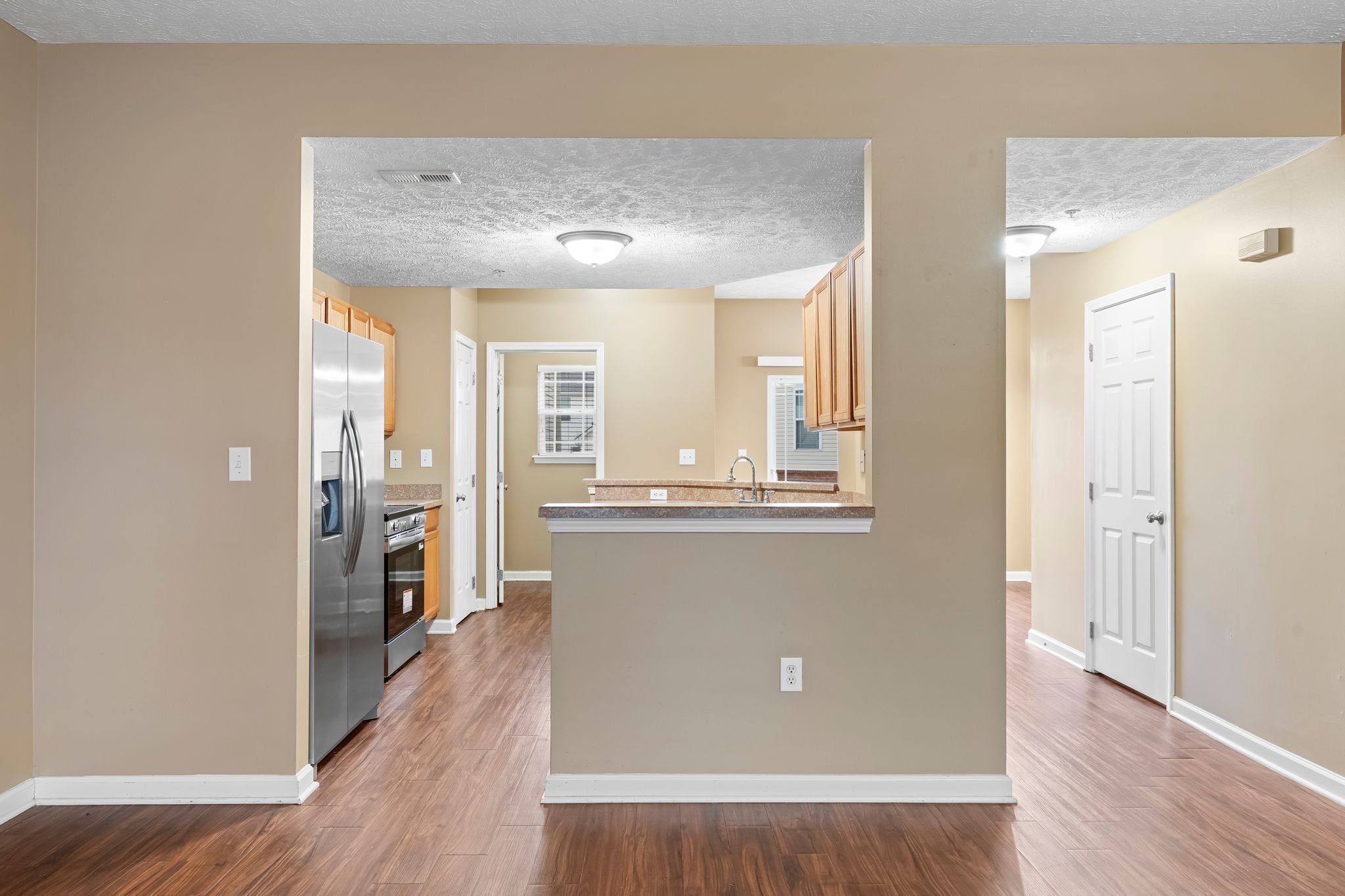 1000 Wells Way Spring Hill, TN 37174 - Photo 8 of 36 wooden floor in an empty room with a window